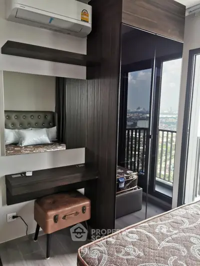 Modern bedroom with balcony view in high-rise apartment