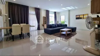 Spacious modern living room with elegant decor and ample natural light