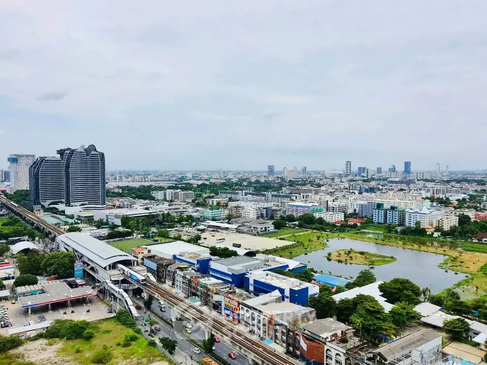 Stunning cityscape view showcasing urban skyline and lush greenery, perfect for real estate investment.