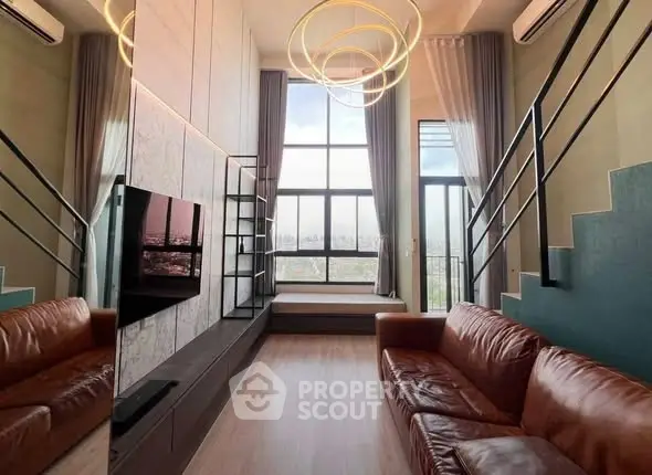 Luxurious modern living room with high ceilings, large windows, and stylish lighting.