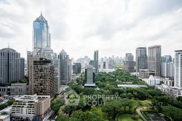 Stunning cityscape view with lush greenery and modern skyscrapers.