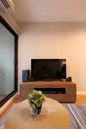 Modern living room with sleek TV setup and stylish decor