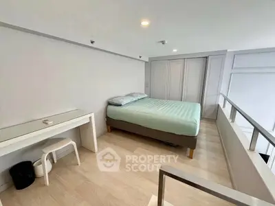 Modern minimalist bedroom with sleek design and ample storage space.