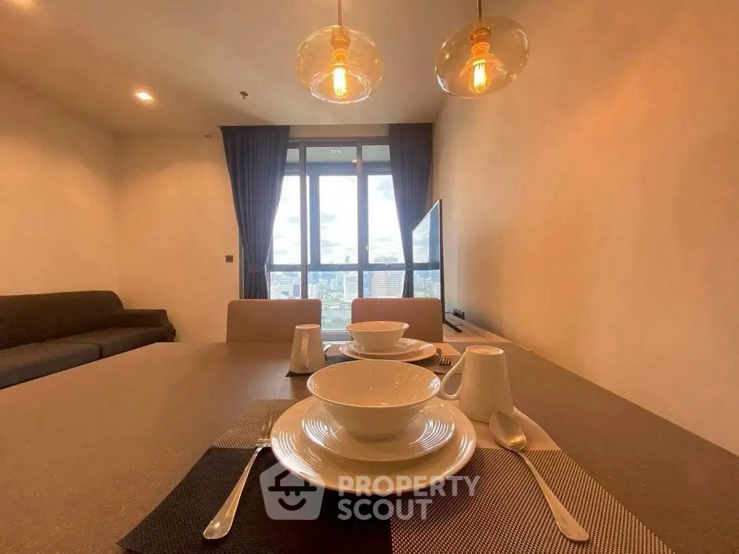 Modern dining area with elegant table setting and city view