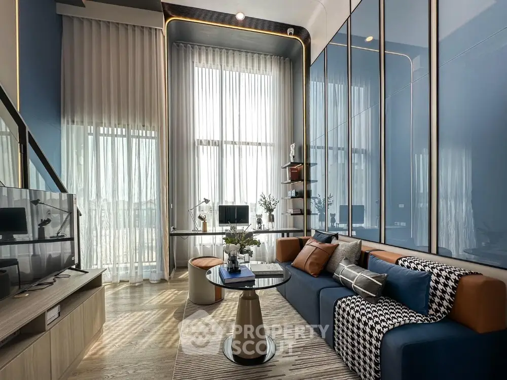 Modern living room with high ceilings and stylish decor