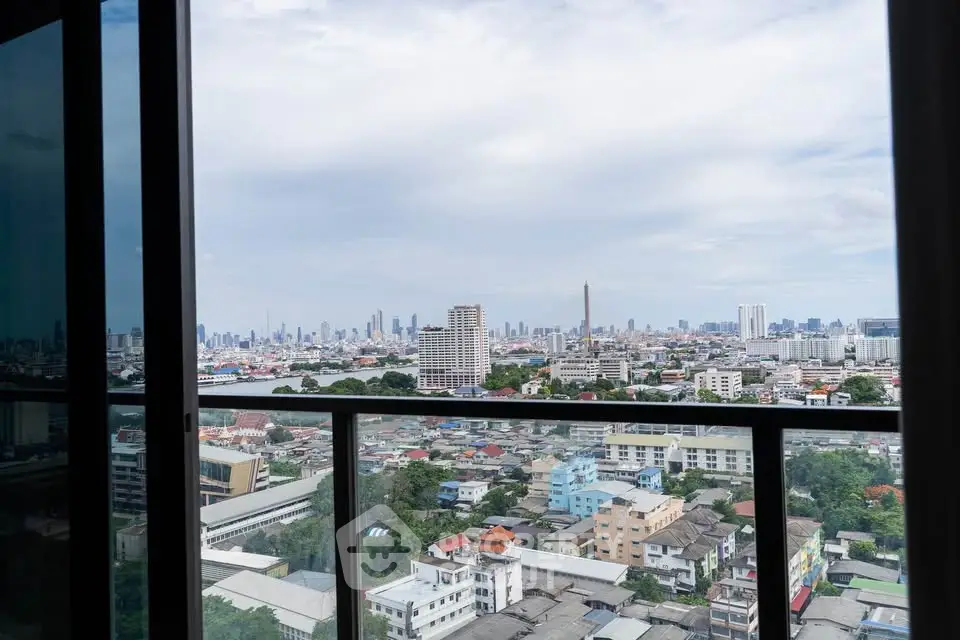 Stunning cityscape view from high-rise balcony, perfect for urban living enthusiasts.