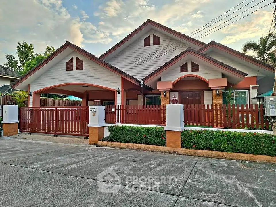 Charming suburban house with a spacious driveway and wooden fence, perfect for family living.