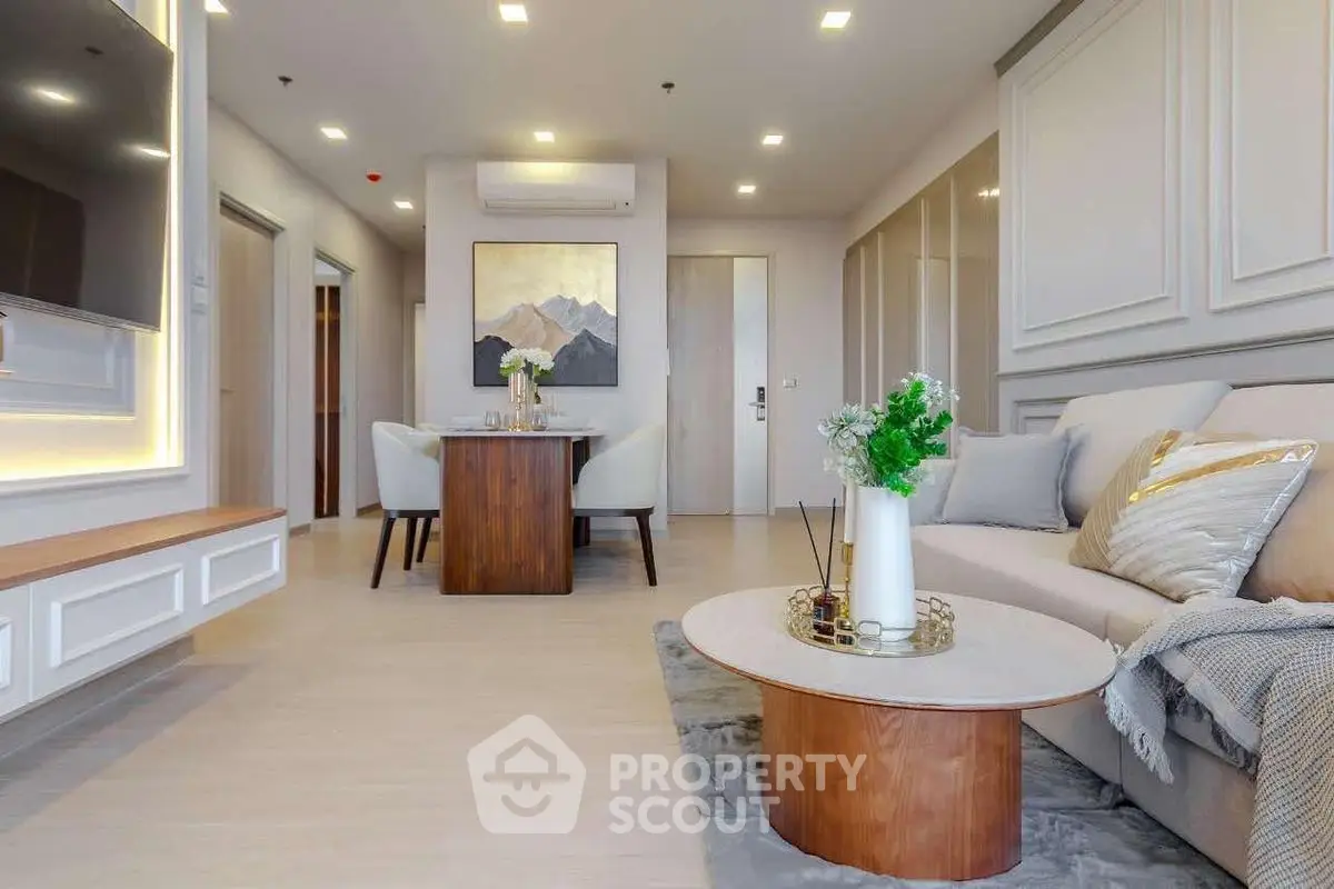 Modern living room with elegant decor and cozy seating area, perfect for relaxation and entertainment.
