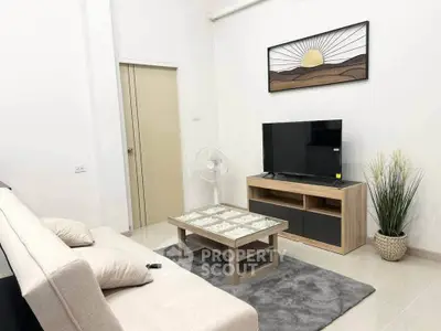 Modern living room with stylish decor and entertainment center