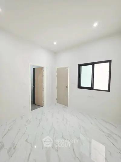 Modern minimalist room with marble flooring and bright lighting