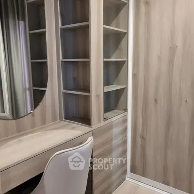 Modern study area with wooden shelves and stylish chair