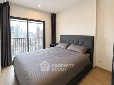 Modern bedroom with city view and stylish decor in high-rise apartment