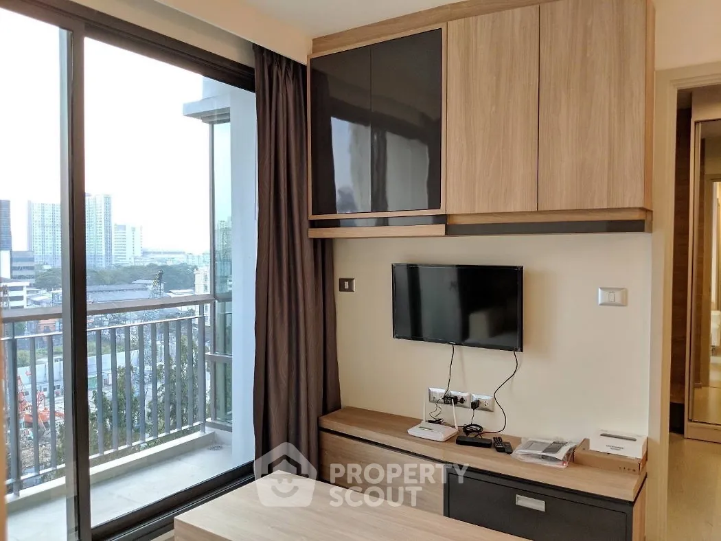 Modern living room with city view and sleek furniture in high-rise apartment