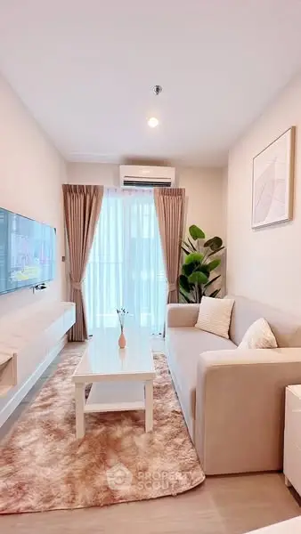 Modern living room with cozy sofa, stylish decor, and natural light.