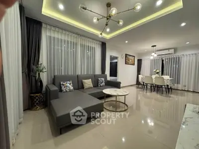 Modern living room with stylish furniture and elegant lighting