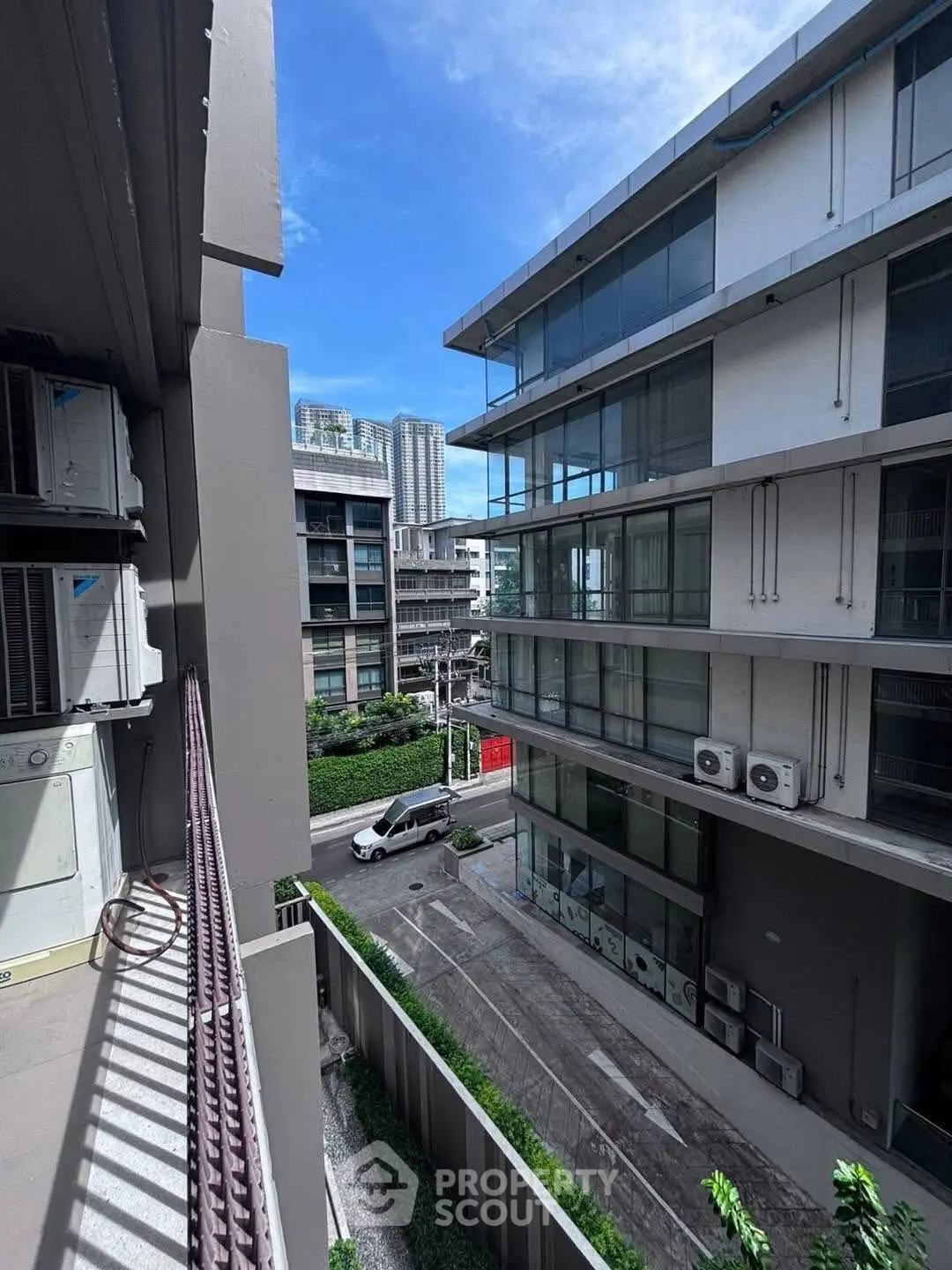 Modern urban apartment view with sleek architecture and clear blue sky