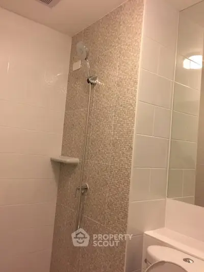 Modern bathroom with sleek shower design and elegant tile work