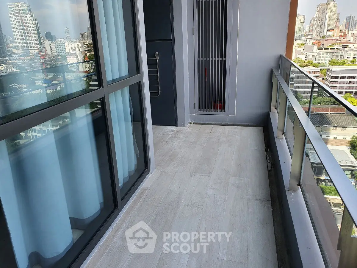 Spacious balcony with city view, perfect for relaxation and enjoying the urban skyline.