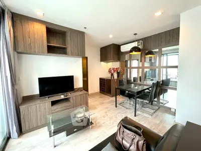 Modern living room with stylish furniture and large windows in a contemporary apartment.