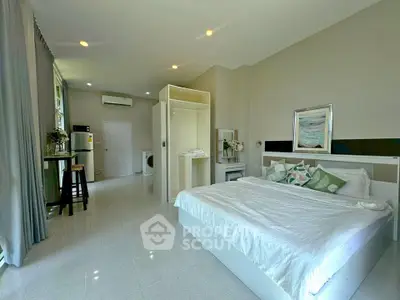 Spacious modern bedroom with open layout and stylish decor
