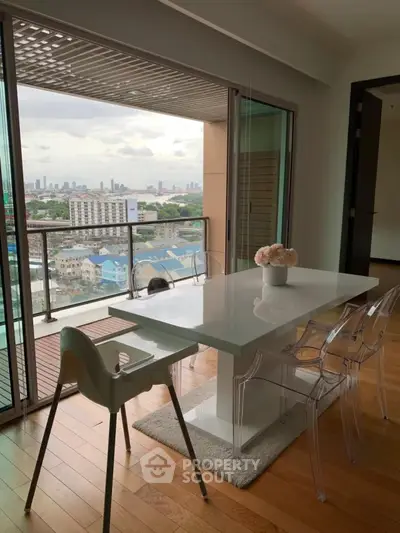 Modern dining area with stunning city view and sleek furniture