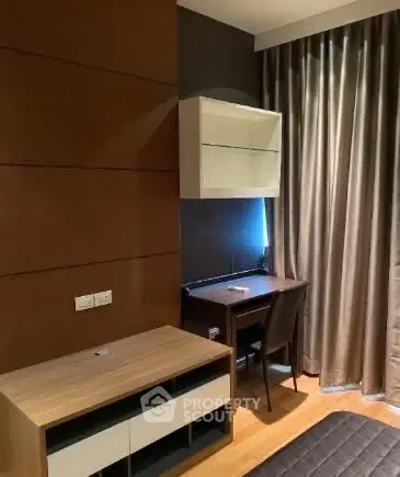 Modern study area with sleek desk and shelving, perfect for productivity.