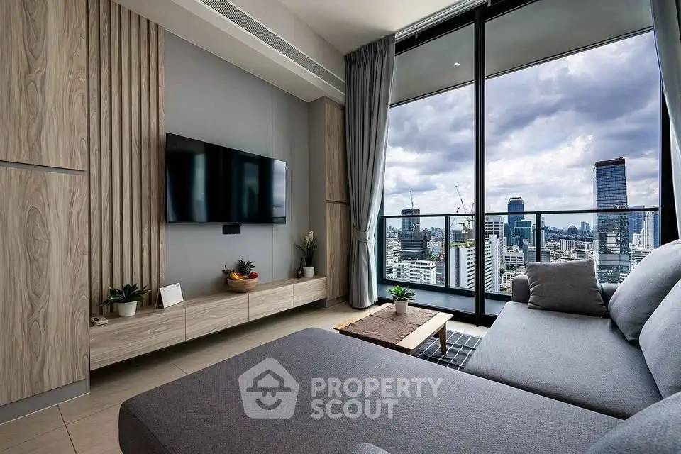 Modern living room with stunning city view and large balcony access.