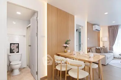 Modern open-plan living and dining area with stylish decor and natural light.