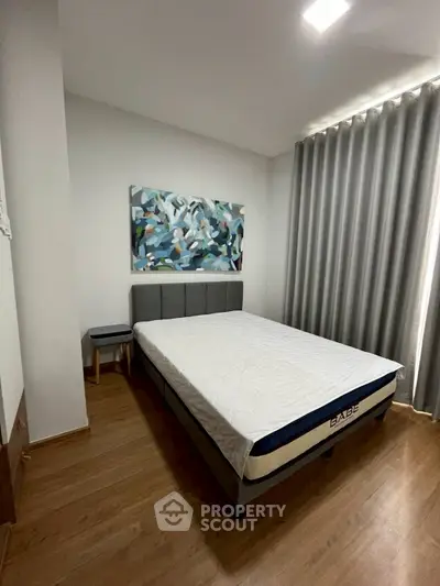 Modern bedroom with stylish decor and natural light