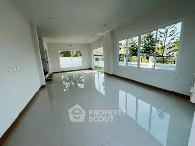 Spacious corner unit with large windows and garden view, perfect for modern living.