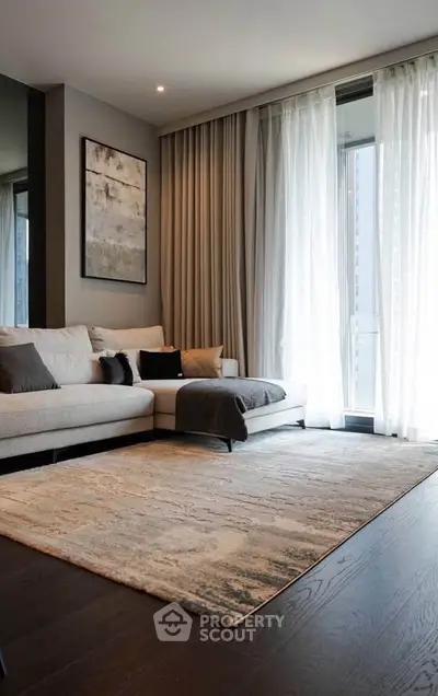 Elegant living room with modern decor and large windows