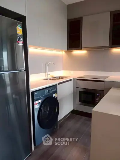 Modern kitchen with sleek appliances and stylish cabinetry