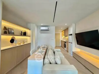 Modern living room with sleek furniture and integrated kitchen appliances