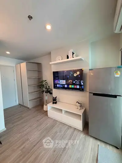 Modern living room with sleek TV setup and stylish shelving, perfect for contemporary living.