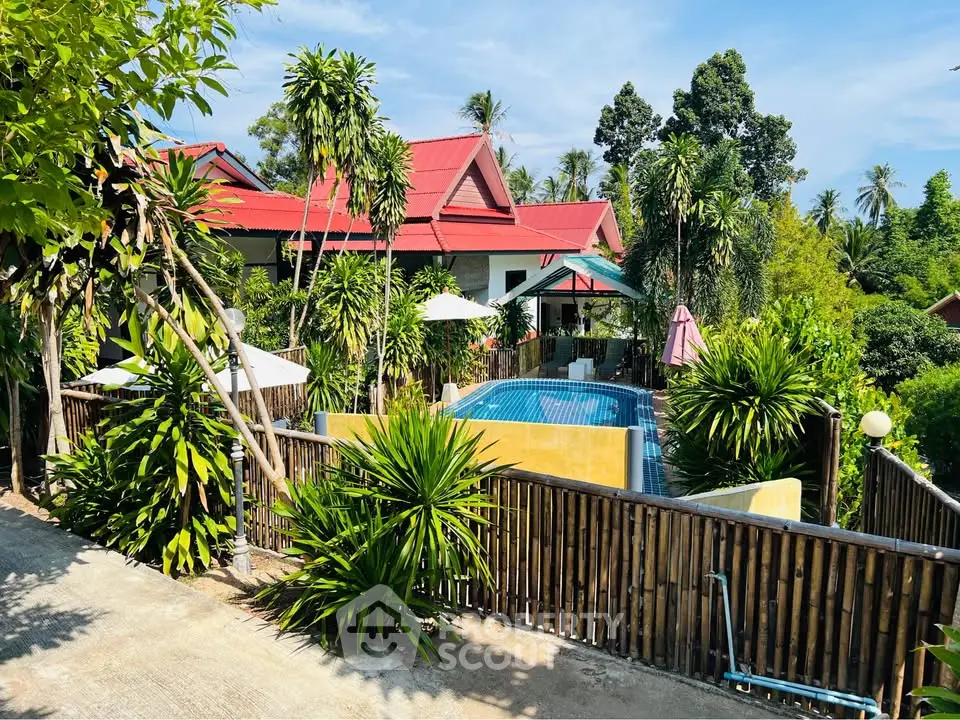 Tropical villa with lush garden and private pool, perfect for serene living.