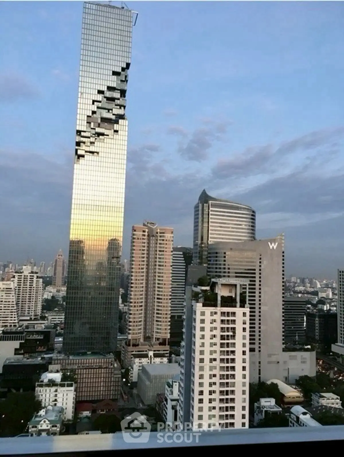 Stunning cityscape view featuring iconic skyscrapers at sunset.