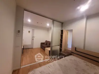 Modern apartment interior with sliding glass doors and cozy living area