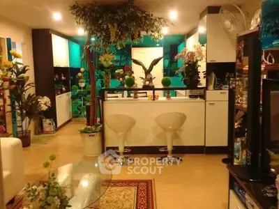 Stylish living room with modern kitchen and vibrant decor