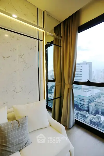 Luxurious high-rise apartment with stunning city view and elegant interior design.