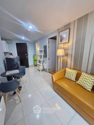 Modern living room with stylish decor and cozy seating in a contemporary apartment.