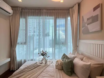 Modern bedroom with large windows and stylish decor in urban apartment