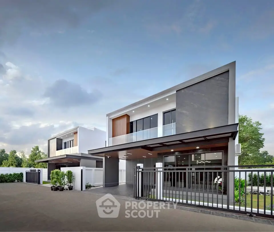 Modern architectural design of luxury home with sleek lines and spacious driveway.