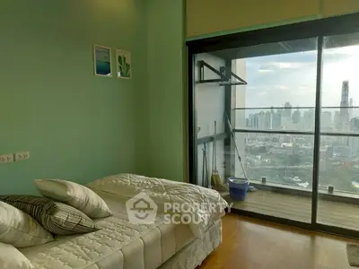 Modern bedroom with stunning city view from large balcony window