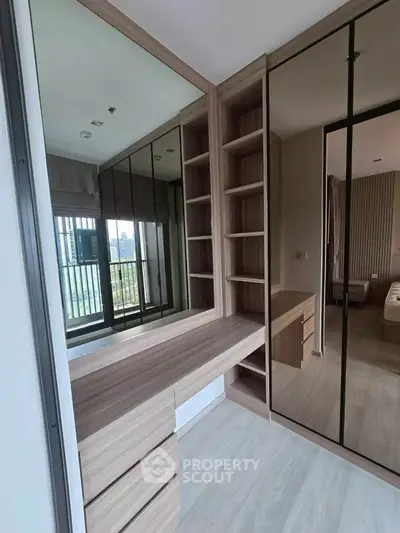 Modern bedroom with stylish built-in wardrobe and city view