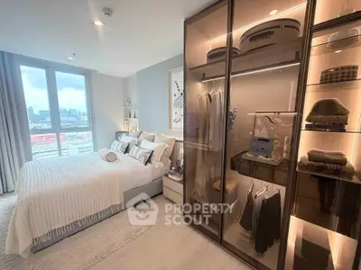 Luxurious bedroom with city view and stylish walk-in closet in modern apartment.