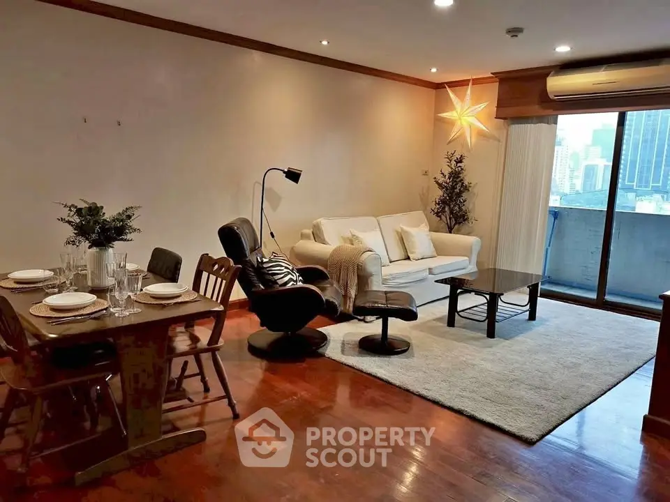 Spacious living room with elegant decor and city view balcony in modern apartment.