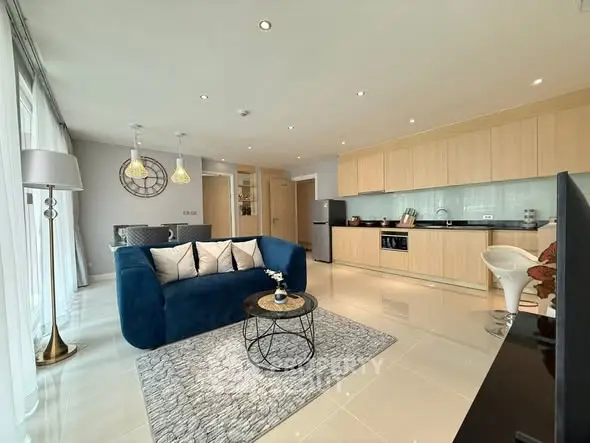 Modern open-plan living room with stylish kitchen and elegant decor