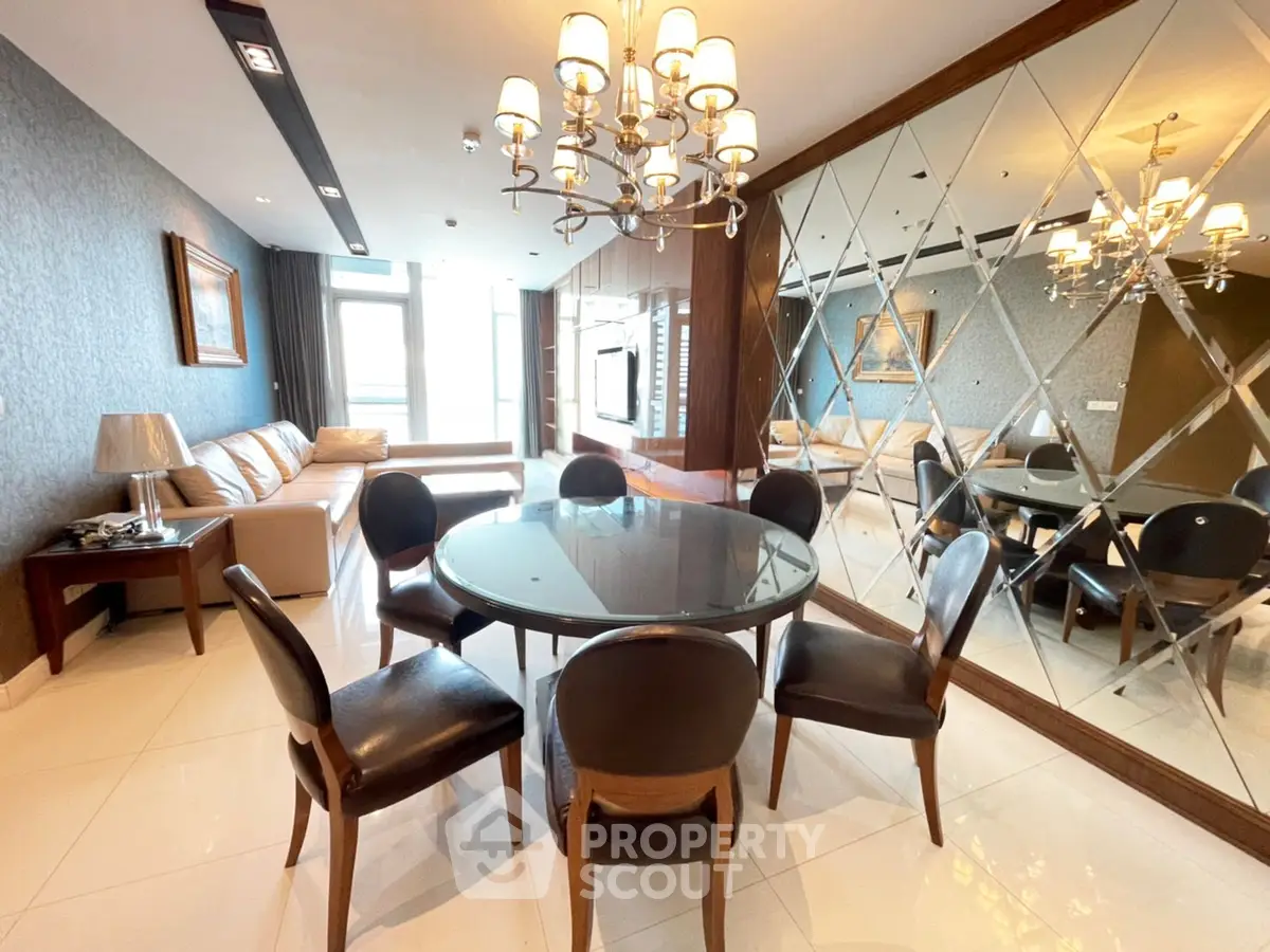 Luxurious living room with elegant dining area and mirrored wall