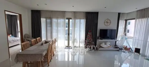 Spacious living room with dining area and modern decor