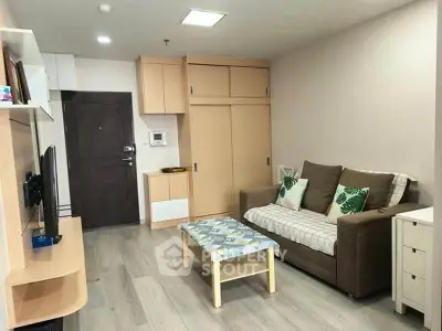 Modern living room with cozy sofa and stylish decor in a contemporary apartment.
